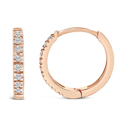 Pair of rose-colored hoop earrings shown from the front and side angles, each adorned with round white gemstones set in a row on the outer edge.