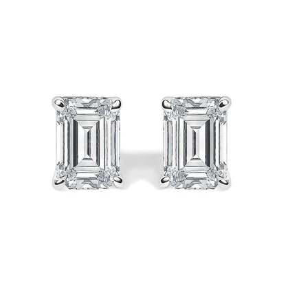 Close-up front view of a pair of white metal stud earrings featuring emerald-shaped white gemstones in 4-prong settings.