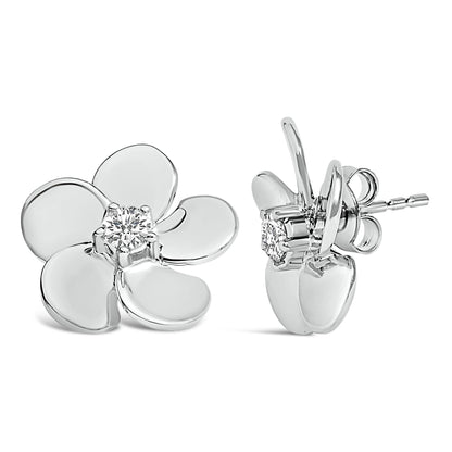 White metal flower-shaped stud earrings with a round white gemstone at the center, shown from front and side angles.