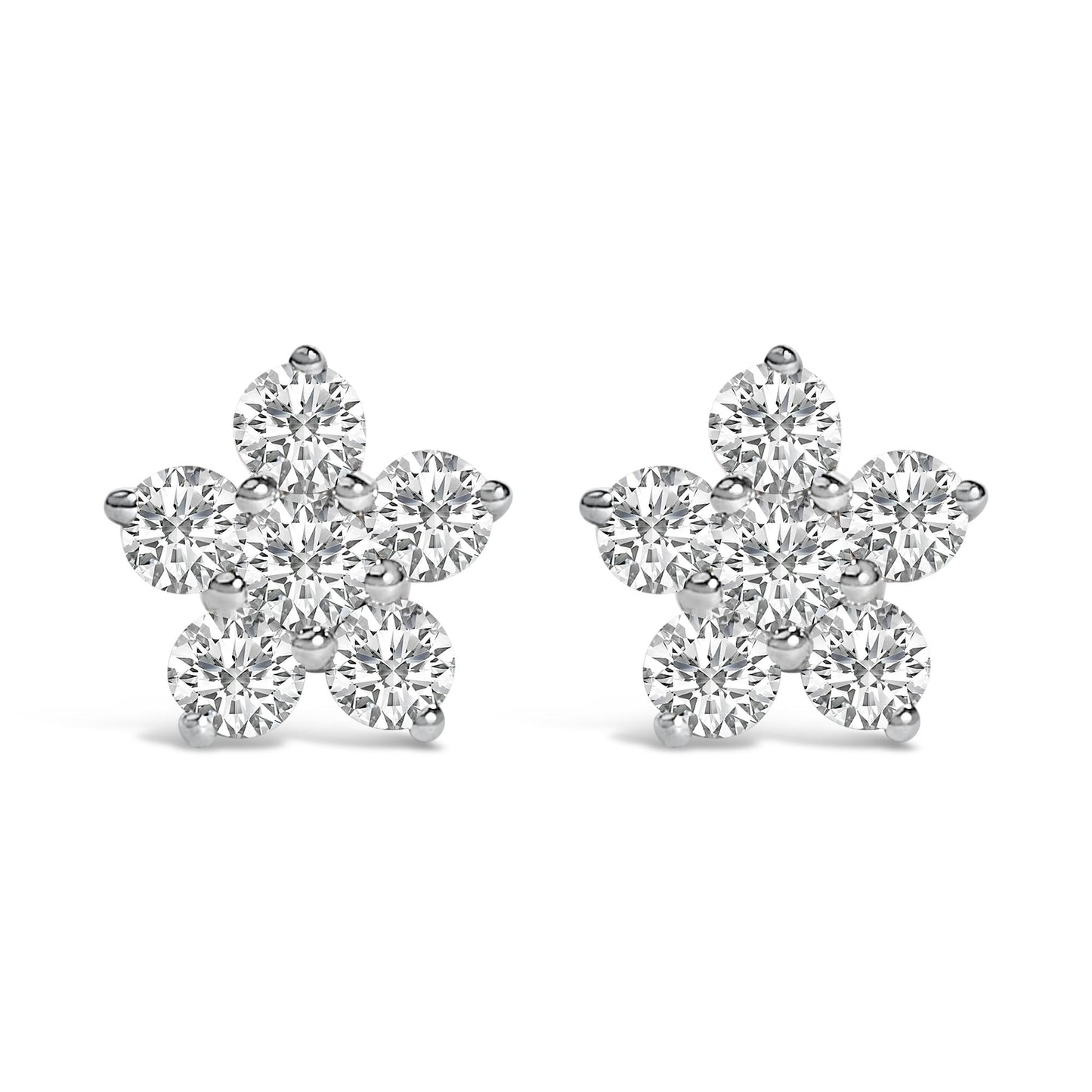 Pair of white metal flower-shaped earrings with round white gemstones in prong settings, shown from the front on a white background.