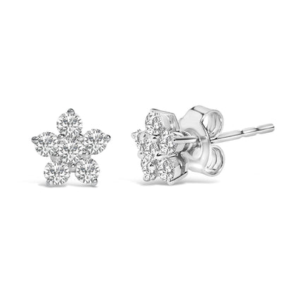 Pair of white metal stud earrings shown from front and side angles, each designed as a flower shape with round white gemstones in prong settings.
