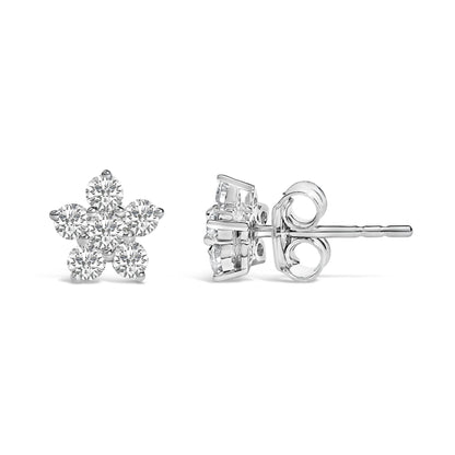 Pair of white metal earrings shown from front and side angles, each featuring a flower-shaped cluster of round white gemstones in prong settings.