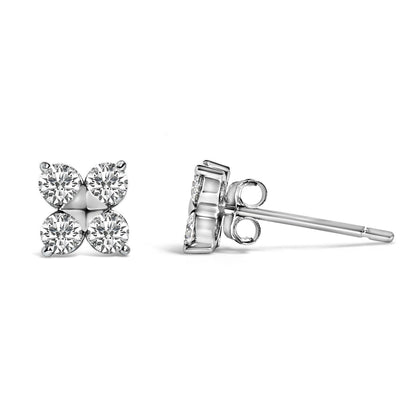 Close-up front and side view of a pair of white metal stud earrings with round white gemstones set in a cluster pattern.