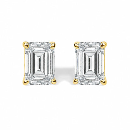 Close-up front view of yellow metal stud earrings featuring rectangular white gemstones in four-prong settings, shown on a white background.