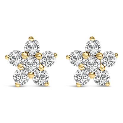 Pair of yellow metal earrings designed as star shapes with round white gemstones in prong settings, shown from the front angle on a white background.