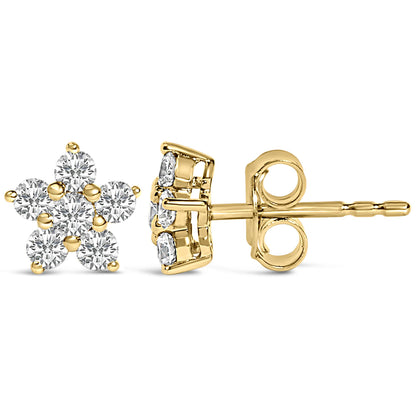 Pair of yellow metal stud earrings shown from the front and side, each designed in a floral cluster shape with round white gemstones in prong settings.