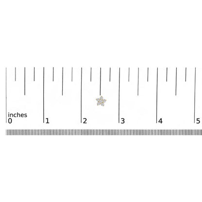 Yellow metal earring with round white gemstones in prong settings forming a floral shape, shown on a ruler scale from a top-down angle.