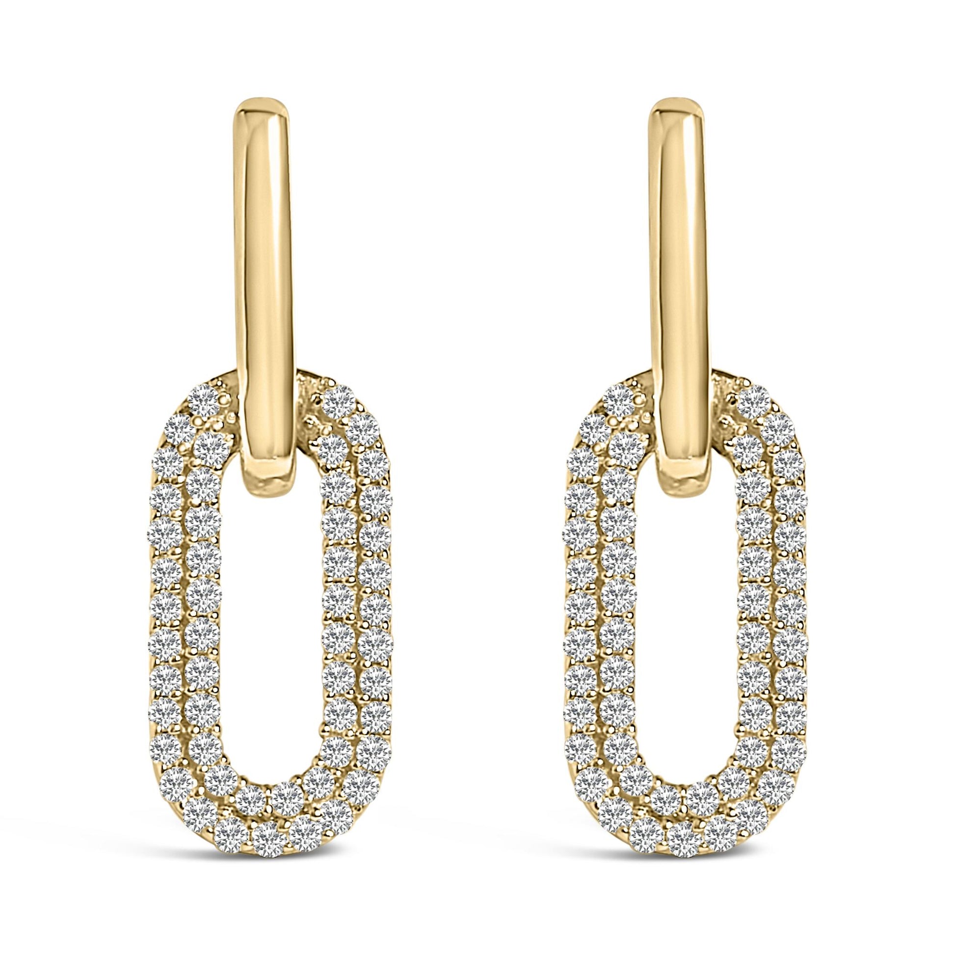 Front angle view of a pair of yellow metal earrings featuring elongated oval shapes encrusted with round white gemstones in a shared prong setting.