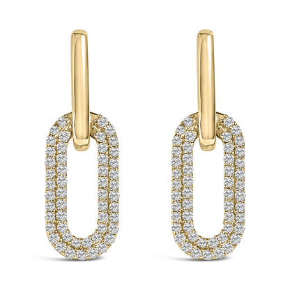 Front angle view of a pair of yellow metal earrings featuring elongated oval shapes encrusted with round white gemstones in a shared prong setting.
