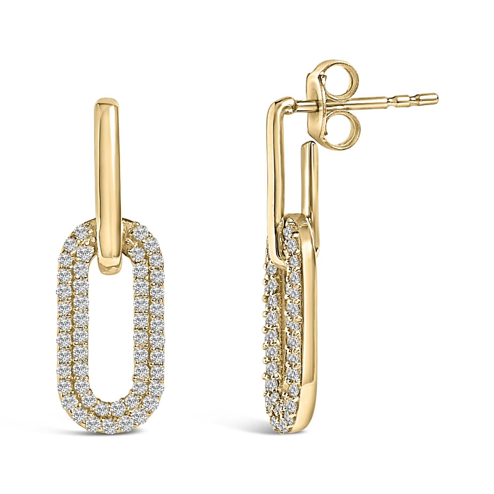 Front and side view of yellow metal earrings with elongated oval shapes encrusted with white round gemstones in a shared prong setting, shown on a white background.