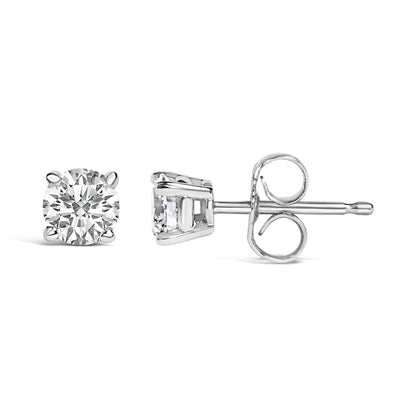 Close-up front and side views of a single white metal stud earring with a round white gemstone in a 4-prong setting.