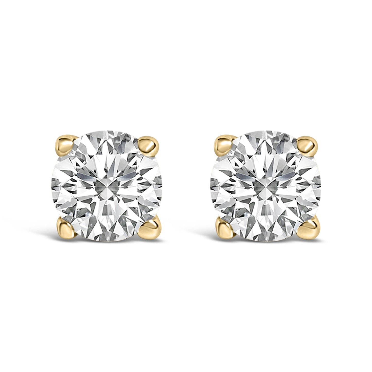 Front view of a pair of yellow metal stud earrings each set with a round white gemstone in a four-prong setting, shown on a white background.