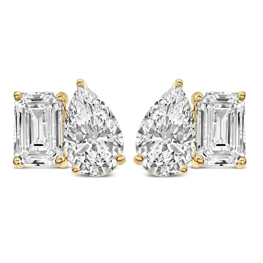 Pair of yellow metal earrings with white emerald-shaped gemstones in four-prong settings next to pear-shaped white gemstones in three-prong settings, shown from the front on a white background.