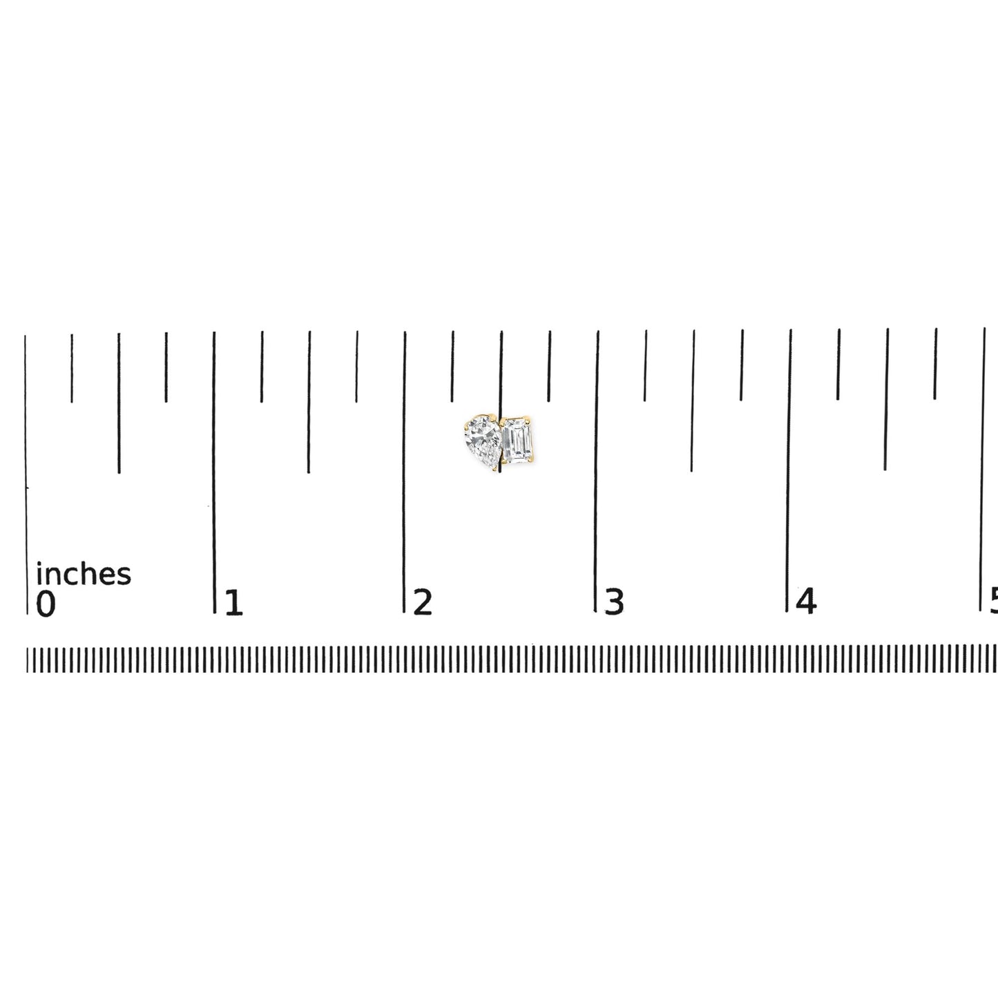 Close-up front view of a pair of yellow metal earrings shown on a scale, featuring one white emerald-shaped gemstone in a four-prong setting and one white pear-shaped gemstone in a three-prong setting.