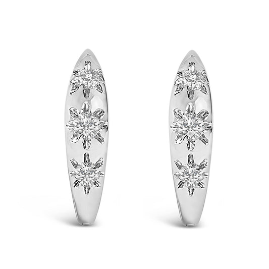 Pair of white hoop earrings with three round white gemstones in prong settings on each, shown in a front-facing angle on a white background.