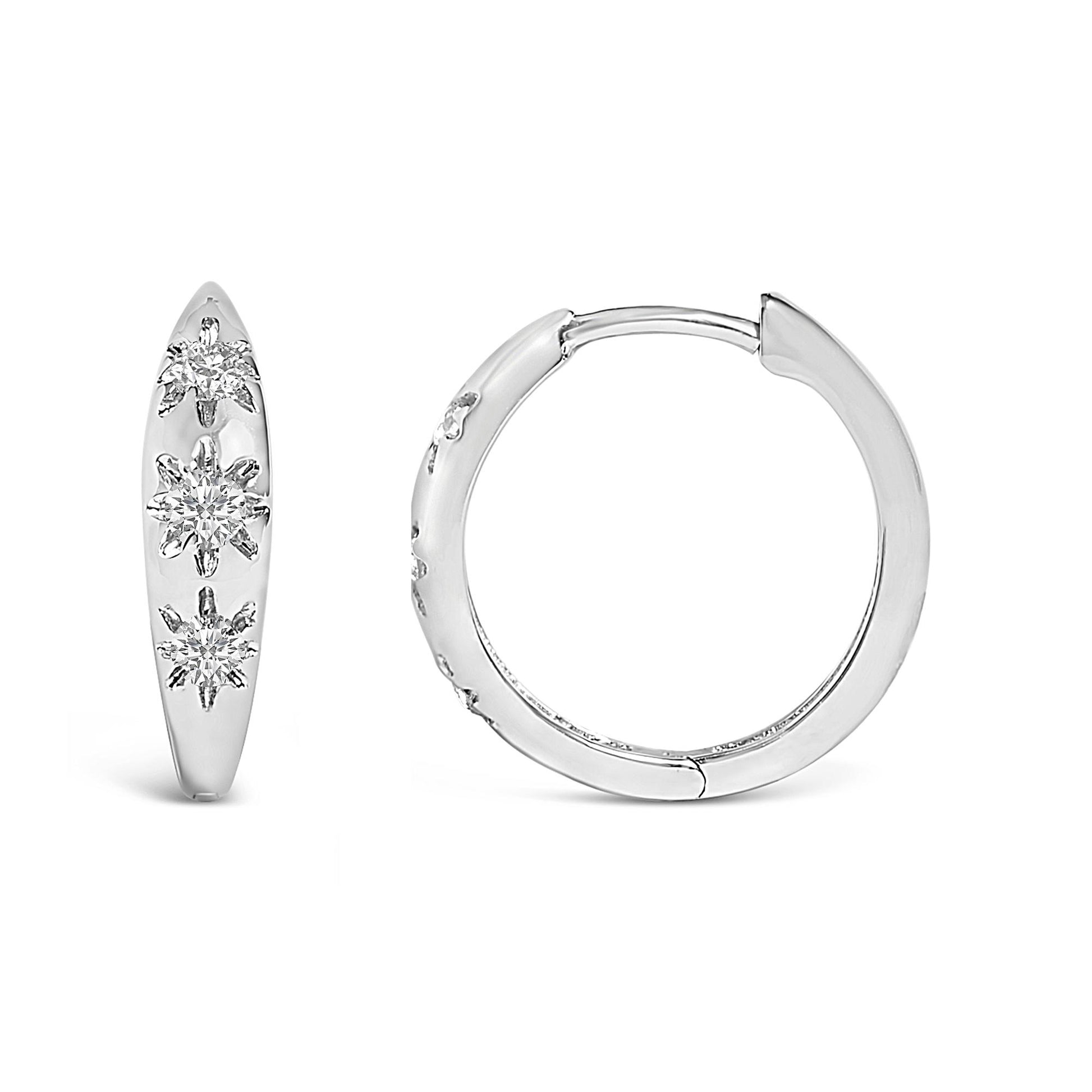 White metal hoop earrings with round white gemstones in prong settings, shown in front and side views on a white background.