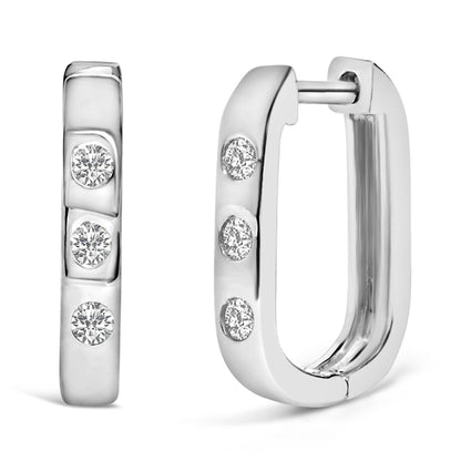 Close-up front and side view of white metal rectangular hoop earrings with round white gemstones set in bezel settings.