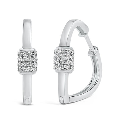 Close-up front and side view of a pair of white metal hoop earrings with a rectangular section featuring multiple rows of round white gemstones in shared prong settings.