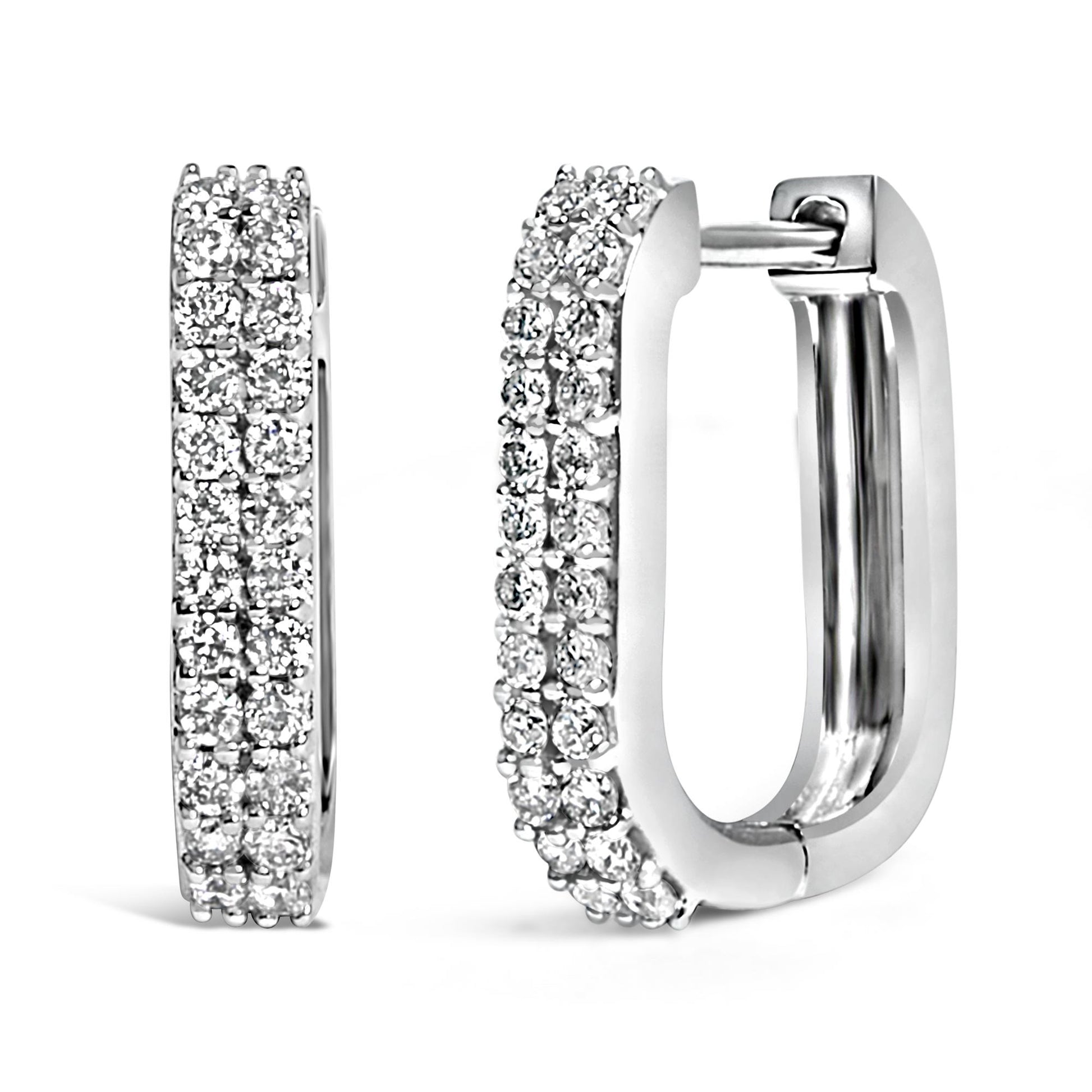 Close-up front and side views of white metal rectangular hoop earrings set with multiple rows of round white gemstones in shared prong settings.