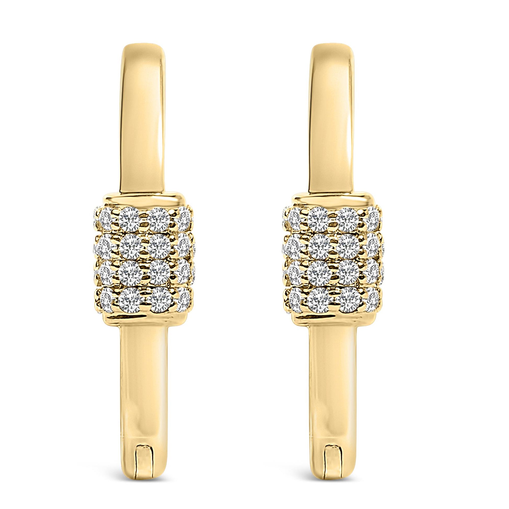 Front view of a pair of yellow metal hoop earrings featuring clustered round white gemstones in a shared prong setting along the front.