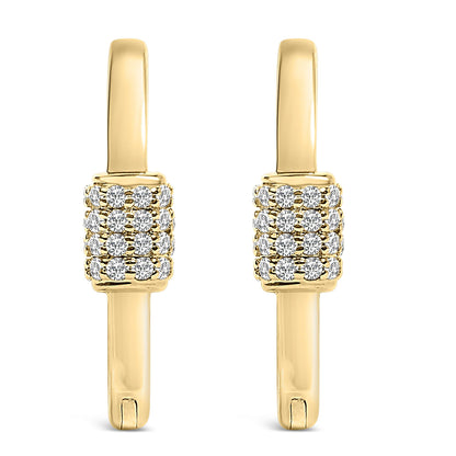 Front view of a pair of yellow metal hoop earrings featuring clustered round white gemstones in a shared prong setting along the front.