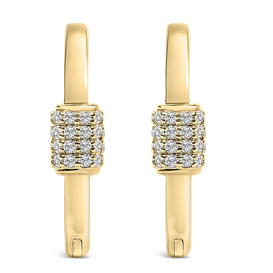 Front view of a pair of yellow metal hoop earrings featuring clustered round white gemstones in a shared prong setting along the front.