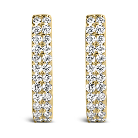 Front view of a pair of yellow metal earrings, each set with multiple white round gemstones in shared prong settings.