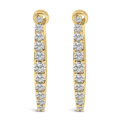 Front-facing close-up of a pair of yellow metal hoop earrings each set with a row of white round gemstones in a shared prong setting.