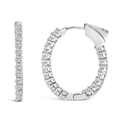 Front and side views of a pair of white hoop earrings featuring round white gemstones set in a shared prong setting, shown on a white background with a close-up angle.