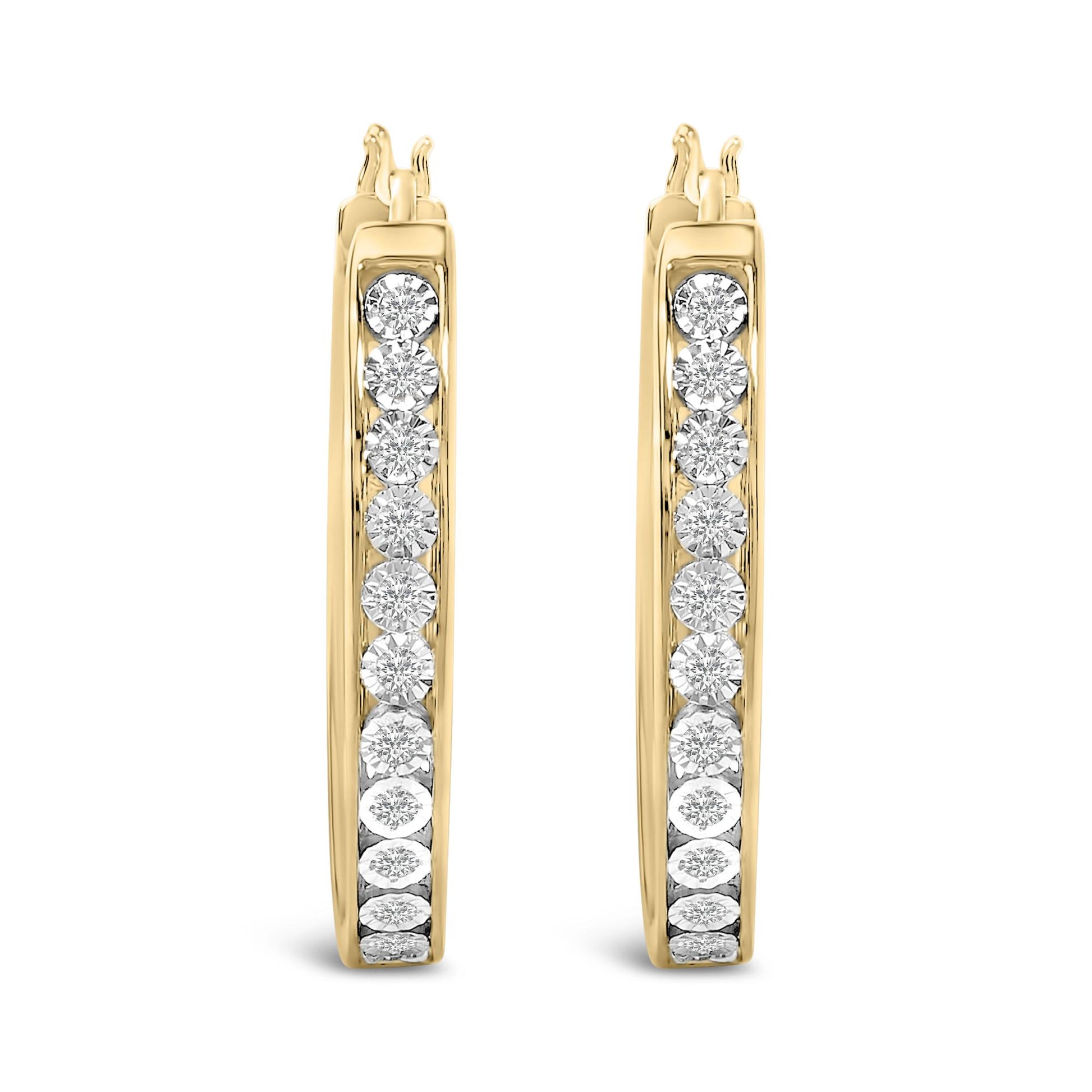 Front-facing close-up of a pair of curved earrings in yellow and white metal, each featuring a vertical row of round white gemstones in bezel settings.