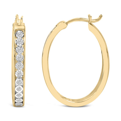 Close-up front and back view of a pair of yellow and white metal hoop earrings with round white gemstones in bezel settings along the front.