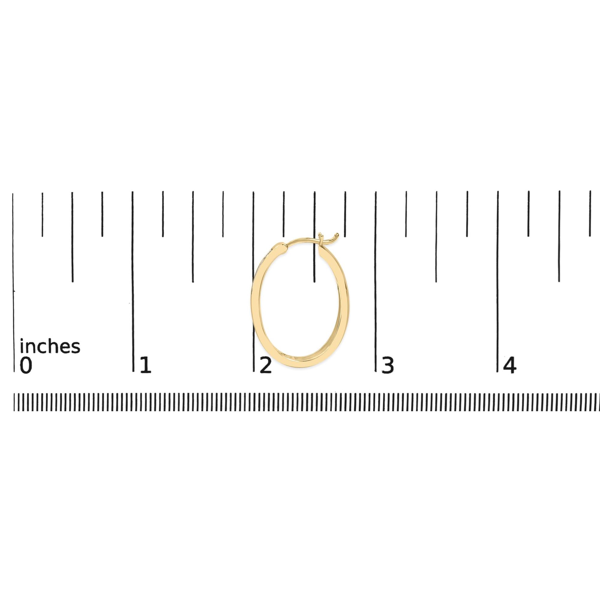 Yellow and white metal hoop earring shown on a scale, front view.