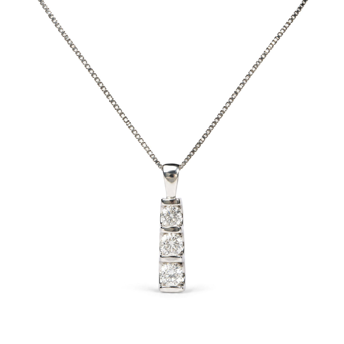 Close-up front view of a white necklace chain with a vertical bar pendant featuring three round white gemstones set in a channel setting.