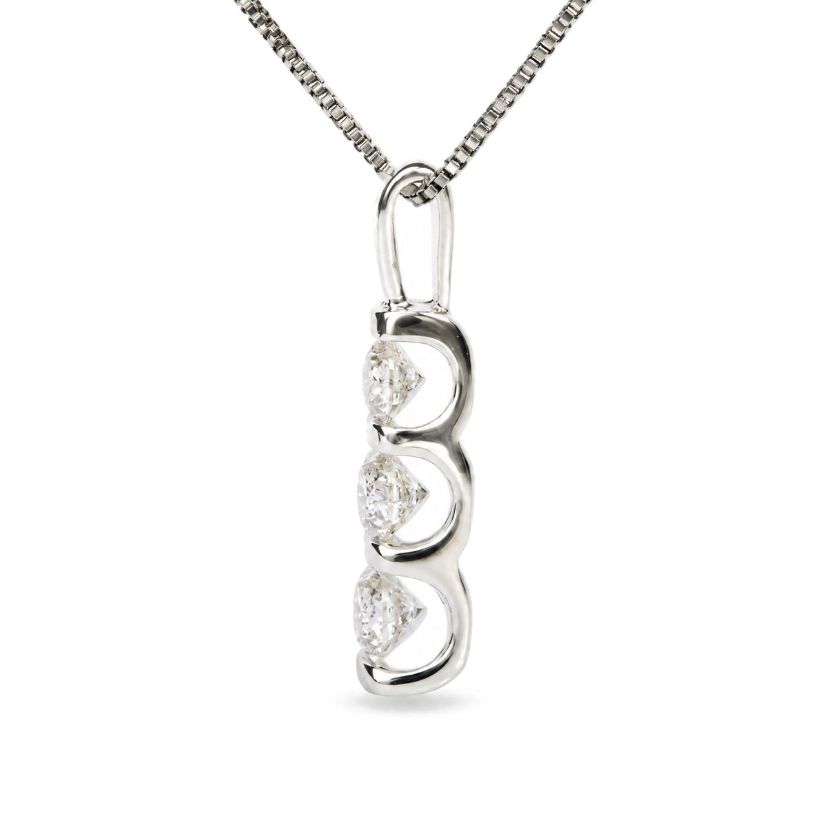 Close-up front angle of a white metal necklace pendant with a vertical bar design featuring three round white gemstones in channel settings, shown on a white background.