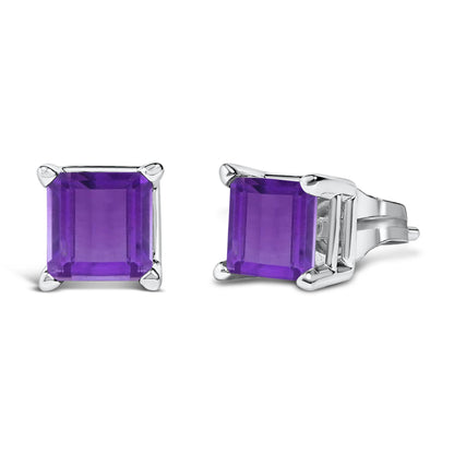 Pair of white metal stud earrings with princess-shaped purple gemstones in four-prong settings, shown from front and side angles on a white background.