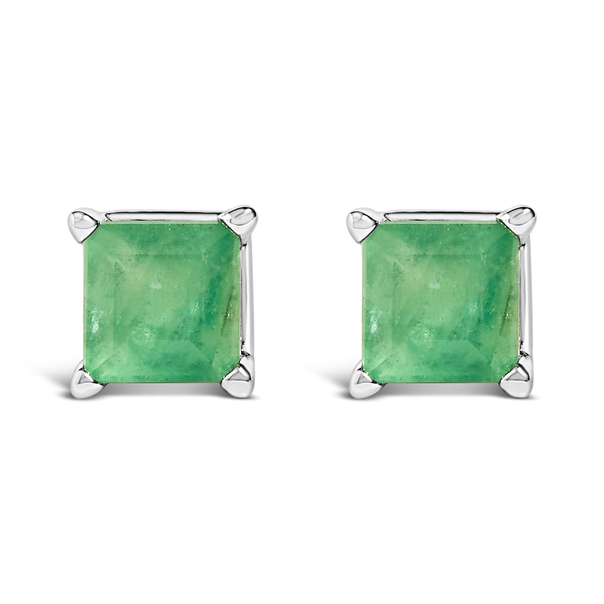 Front-facing shot of a pair of white metal stud earrings, each featuring a square green gemstone in a four-prong setting.