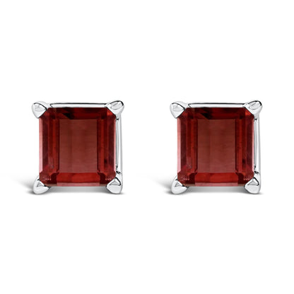 Front view of a pair of square stud earrings featuring red princess-cut gemstones in white metal four-prong settings.