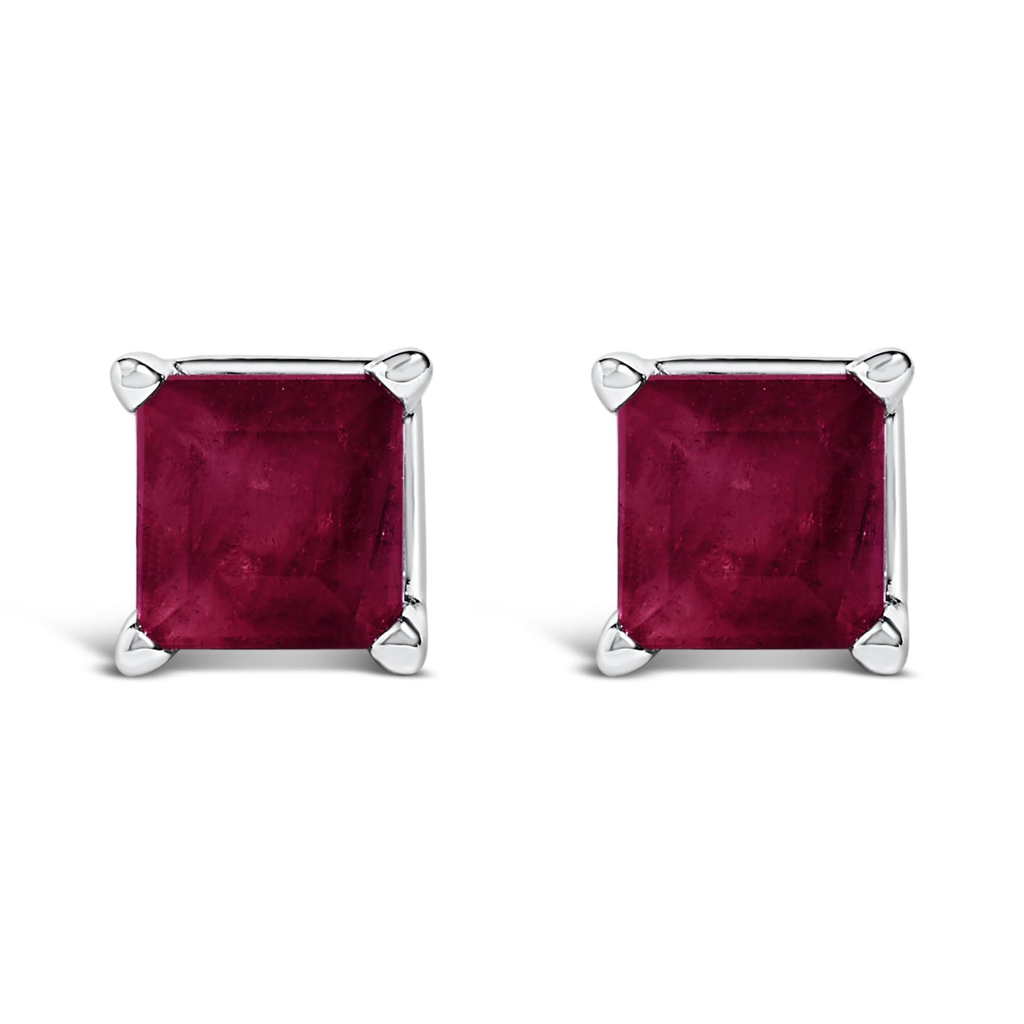 Close-up front view of a pair of white metal square stud earrings with princess-cut red gemstones in four-prong settings.