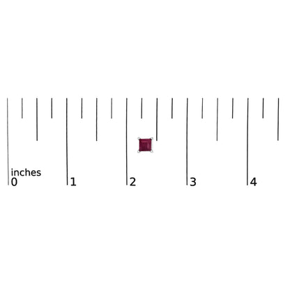 Close-up front view of a single white metal stud earring with a square red gemstone in a four-prong setting shown on a ruler scale.