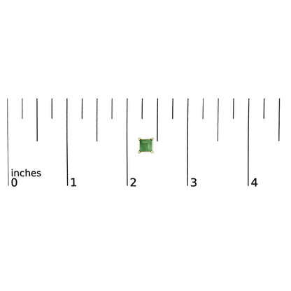 Yellow metal earring with a square green gemstone in a four-prong setting, shown on a scale from a top-down angle.