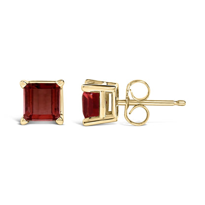 Pair of yellow metal stud earrings with square red gemstones in four-prong settings, shown in a front and side view on a white background.