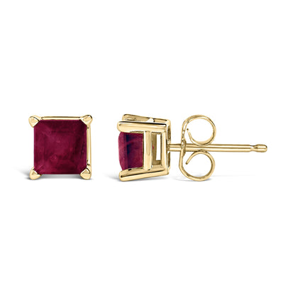 Pair of yellow metal stud earrings with square red gemstones in four-prong settings, shown from front and side angles on a white background.