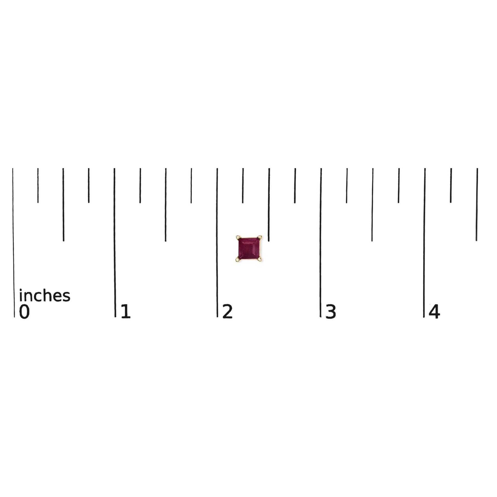 Close-up front view of a single yellow metal stud earring with a princess-shaped red gemstone set in a four-prong setting, shown on a scale.