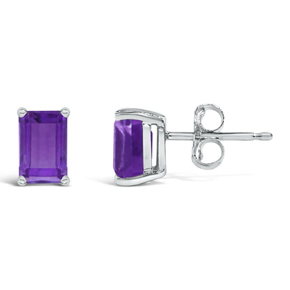 Pair of white metal stud earrings with emerald-shaped purple gemstones set in four prongs, shown from front and side angles on a white background.