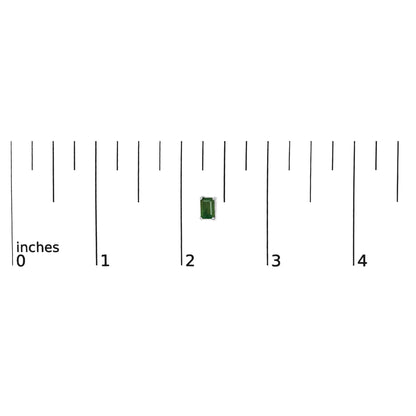 Image of a single white metal earring with a green emerald-shaped gemstone in a four-prong setting, shown on a scale with inch measurements, front view.
