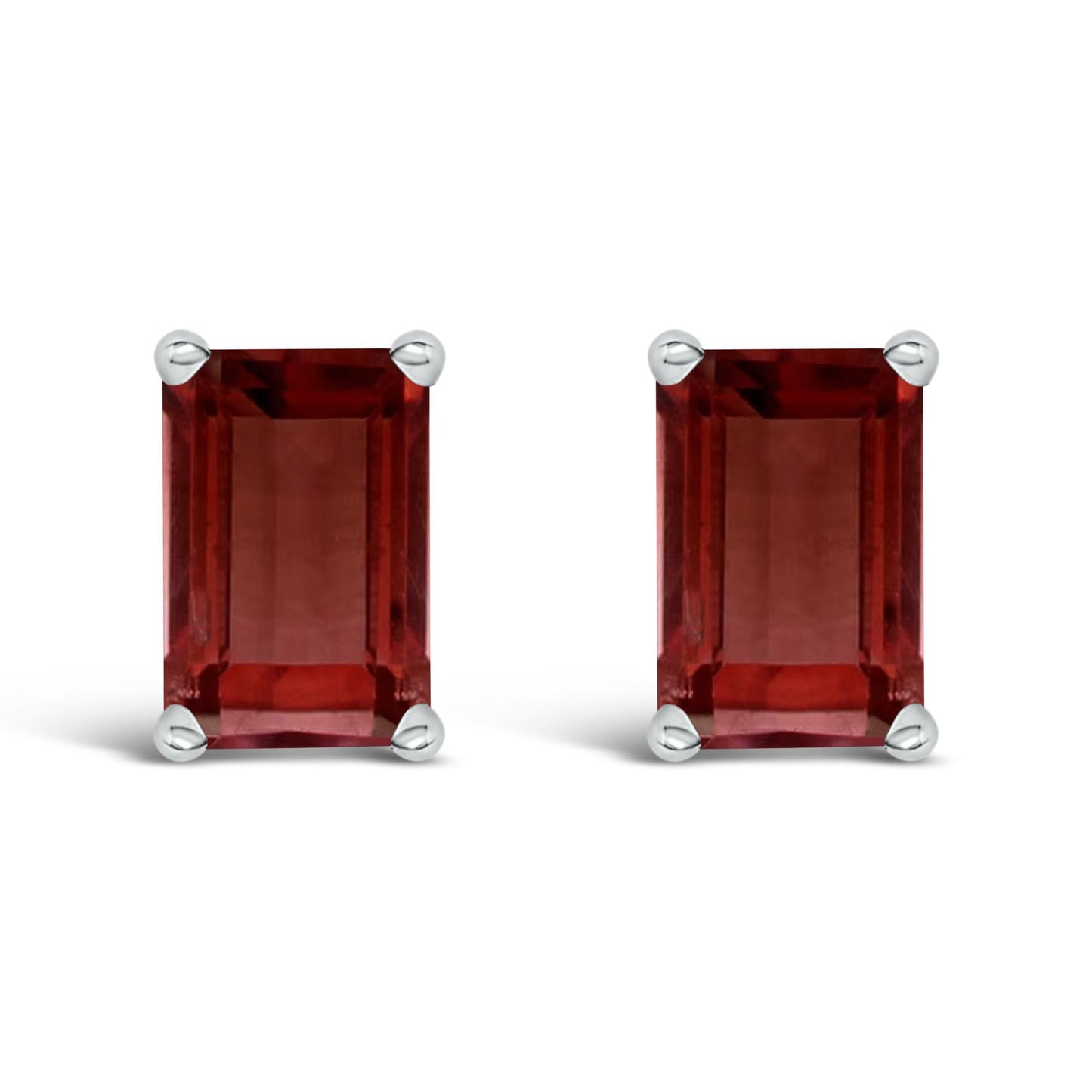Close-up front view of a pair of white metal earrings with rectangular red gemstones set in four-prong settings.