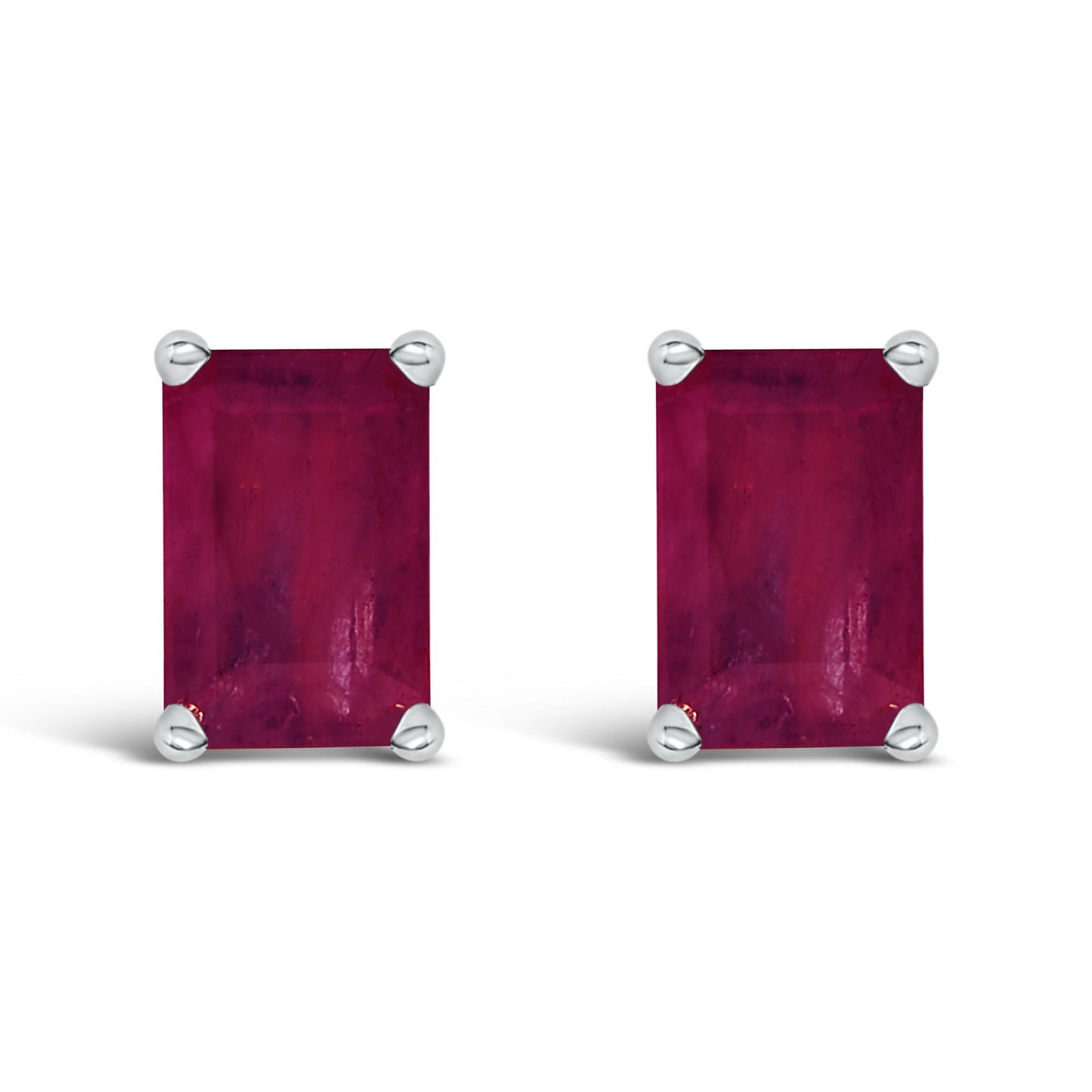 Front view of a pair of rectangular red gemstone earrings set in white metal with four-prong settings.