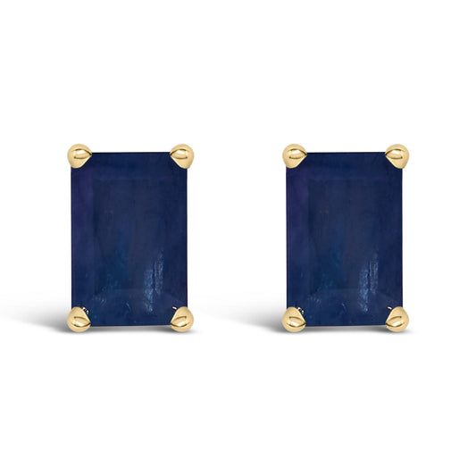 Front view of a pair of yellow metal stud earrings featuring rectangular blue gemstones with four-prong settings.