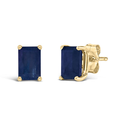 Pair of yellow metal stud earrings with rectangular blue gemstones in four-prong setting, shown from front and side angles on a white background.