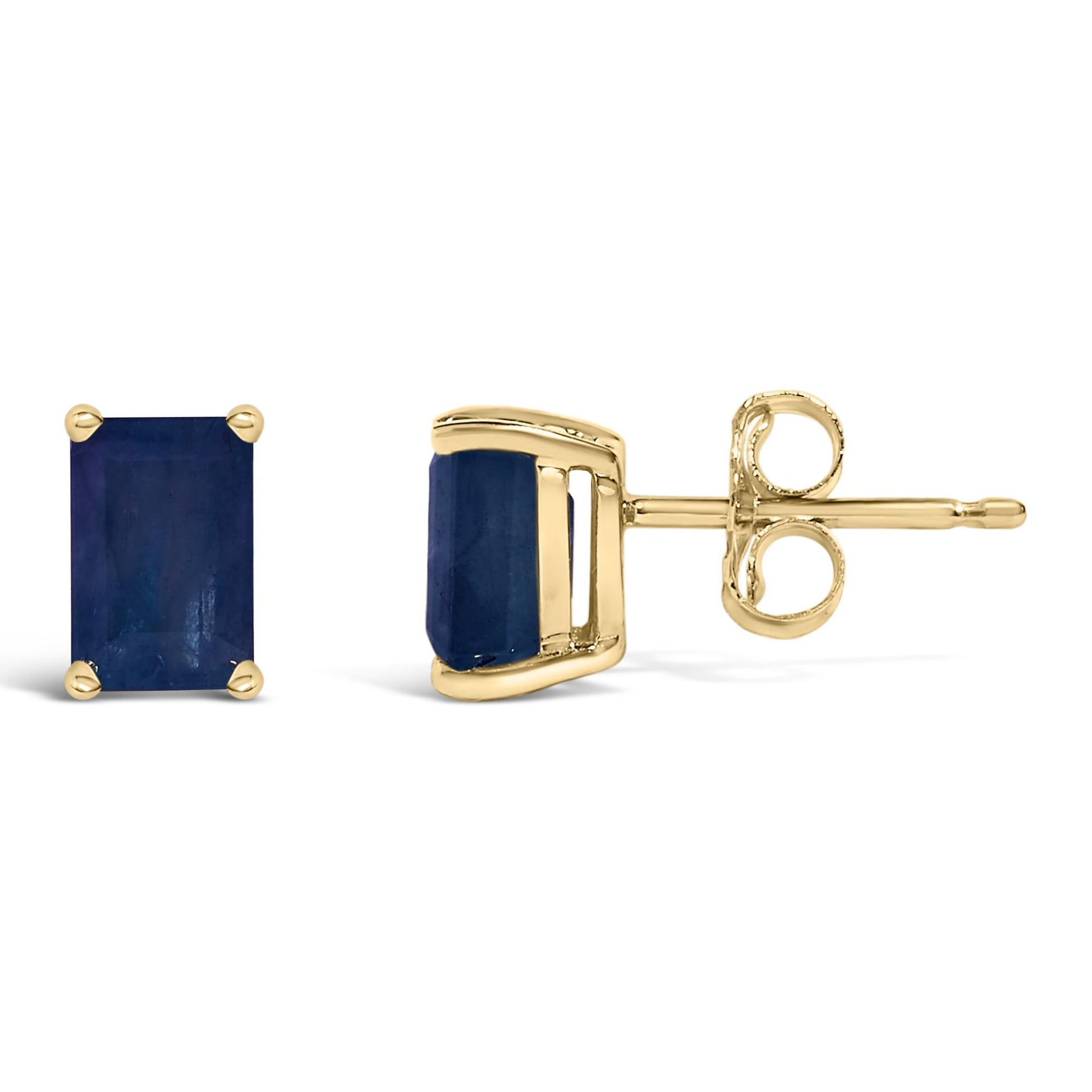 Pair of yellow metal stud earrings with emerald-shaped blue gemstones in four-prong settings, shown from front and side angles on a white background.